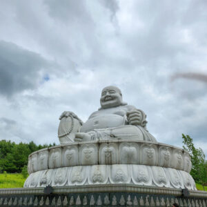 Giant Buddha statue located at the entrance of the gardens