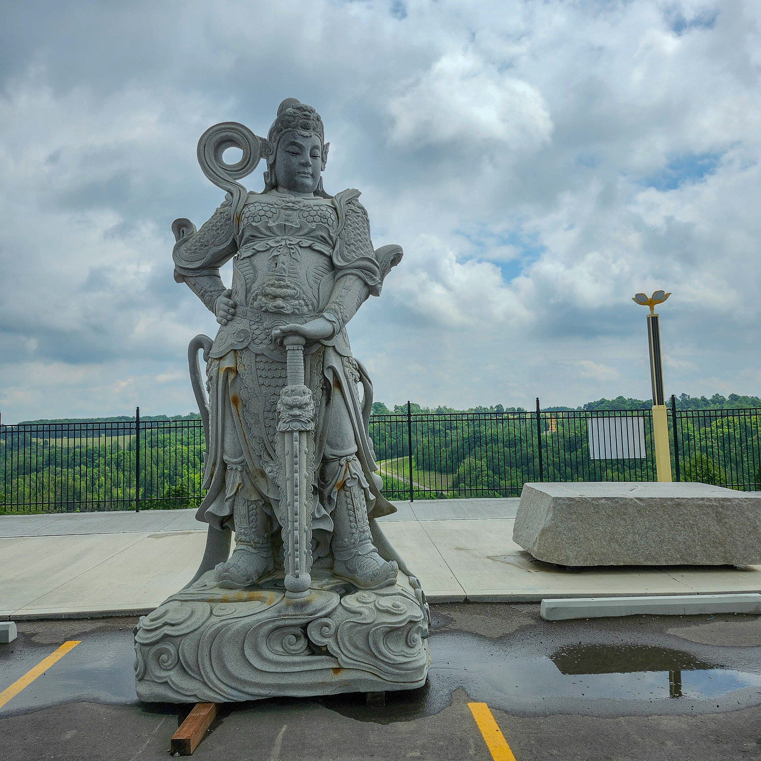 Statue in the parking lot of the temple