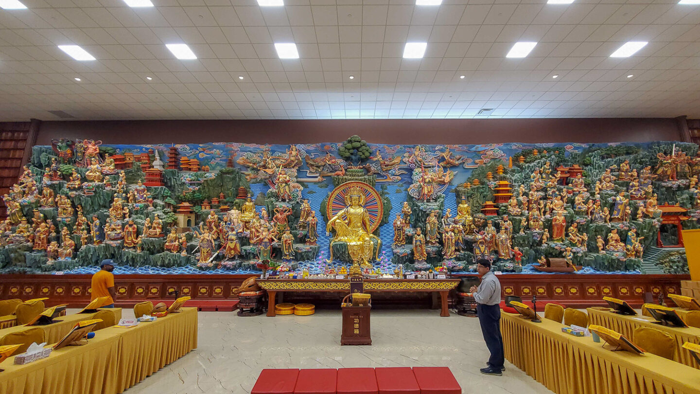 The bottom floor hall, with a large wall to wall religious display