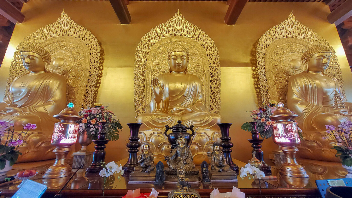 Large golden Buddha on the third floor of the main temple