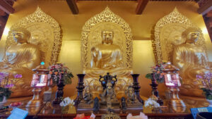 Large golden Buddha on the third floor of the main temple